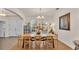 Elegant dining room featuring a large wooden table and hardwood floors at 178 Magneta Loop, Auburndale, FL 33823