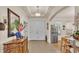 Bright and spacious entryway with tile floors and an antique wooden console table at 178 Magneta Loop, Auburndale, FL 33823