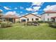 Backyard with pergola and neatly trimmed hedges at 1832 Prima Vista Dr, Lakeland, FL 33810