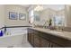 Elegant bathroom with granite countertops and soaking tub at 1832 Prima Vista Dr, Lakeland, FL 33810