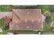 Aerial view of a house with a clay tile roof and a landscaped backyard at 1832 Prima Vista Dr, Lakeland, FL 33810