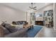 Living room featuring hardwood floors, a fireplace, and ample natural light at 1832 Prima Vista Dr, Lakeland, FL 33810