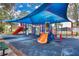 playground with shaded area and various play structures at 1832 Prima Vista Dr, Lakeland, FL 33810