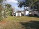 Spacious backyard with grassy area and storage shed at 1914 Alexander Dr, Lakeland, FL 33803