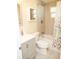 Updated bathroom with tub/shower combo and floral shower curtain at 1914 Alexander Dr, Lakeland, FL 33803