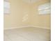 Bright bedroom with neutral walls and tile floors at 1914 Alexander Dr, Lakeland, FL 33803