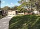 Well-maintained house with a lush green lawn at 1914 Alexander Dr, Lakeland, FL 33803