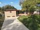 Attractive curb appeal with a neatly kept lawn at 1914 Alexander Dr, Lakeland, FL 33803