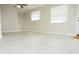 Spacious living room with tile floors and lots of natural light at 1914 Alexander Dr, Lakeland, FL 33803