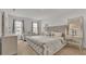 King-size bed, nightstands and a seating area at 1915 Pristine Loop, Lakeland, FL 33811