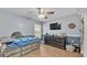 Bedroom with a daybed, dresser, and TV at 2105 Normandy Heights Ln, Winter Haven, FL 33880