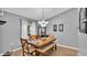 Charming dining room with wooden table and gray walls at 2105 Normandy Heights Ln, Winter Haven, FL 33880