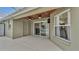 Covered patio with sliding glass doors leading to the pool at 2105 Normandy Heights Ln, Winter Haven, FL 33880