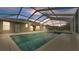 Screened pool and spa at dusk at 2105 Normandy Heights Ln, Winter Haven, FL 33880