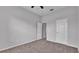 Neutral bedroom with carpet, neutral walls and white trim, featuring two doors at 212 Kissengen Park Dr, Bartow, FL 33830