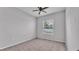 Bedroom with neutral color palette, ceiling fan, and natural light from a window at 212 Kissengen Park Dr, Bartow, FL 33830