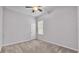 Bright bedroom with window, ceiling fan, and neutral decor at 212 Kissengen Park Dr, Bartow, FL 33830