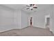 Spacious bedroom featuring neutral walls, plush carpeting, and a ceiling fan for added comfort at 212 Kissengen Park Dr, Bartow, FL 33830