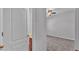Bedroom with plush carpet, a glimpse of a bathroom, and neutral color palette at 212 Kissengen Park Dr, Bartow, FL 33830