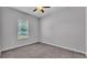 Bedroom featuring a ceiling fan, plush carpet, and a window view to the backyard at 212 Kissengen Park Dr, Bartow, FL 33830