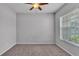 Bedroom featuring neutral colored walls, plush carpet, and a modern ceiling fan at 212 Kissengen Park Dr, Bartow, FL 33830