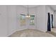 Cozy dining area with chandelier and natural light from two windows overlooking yard at 212 Kissengen Park Dr, Bartow, FL 33830
