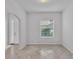 Bright entryway with tile flooring and an arched doorway at 212 Kissengen Park Dr, Bartow, FL 33830