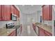 Open concept kitchen with granite counters and stainless steel appliances at 212 Kissengen Park Dr, Bartow, FL 33830