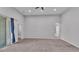 Large living room with neutral colors, carpet, high ceilings, and sliding glass door at 212 Kissengen Park Dr, Bartow, FL 33830