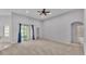 Spacious living room with carpeting and sliding glass doors at 212 Kissengen Park Dr, Bartow, FL 33830