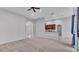 Neutral carpet and open plan view into the kitchen from the living room at 212 Kissengen Park Dr, Bartow, FL 33830