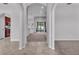 View of the neutral living room showcasing tile entry and gray carpet at 212 Kissengen Park Dr, Bartow, FL 33830