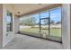 Screened porch overlooking a grassy backyard at 212 Kissengen Park Dr, Bartow, FL 33830