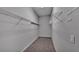 Walk-in closet with carpet and metal shelving for organized storage solutions at 212 Kissengen Park Dr, Bartow, FL 33830