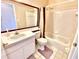 Bathroom with tub, toilet and updated vanity at 2141 Sandy Hook, Lakeland, FL 33813