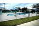 Community pool area with surrounding fence and patio furniture at 2141 Sandy Hook, Lakeland, FL 33813