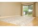 Bright living room featuring hardwood floors, neutral walls, an area rug, and sliding glass doors to the outdoors at 223 Windsor St # 3A, Lakeland, FL 33803