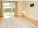 Bright living room featuring hardwood floors, neutral walls, an area rug, and sliding glass doors to the outdoors at 223 Windsor St # 3A, Lakeland, FL 33803