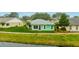 Cute teal home with canal views, great yard at 2266 Silver Re Dr, Lakeland, FL 33810