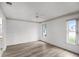 Bright bedroom featuring wood-look flooring and ceiling fan at 2266 Silver Re Dr, Lakeland, FL 33810