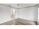 Bedroom with wood-look floors and access to bathroom at 2266 Silver Re Dr, Lakeland, FL 33810