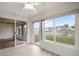 Sunroom with water view and sliding glass doors at 2266 Silver Re Dr, Lakeland, FL 33810