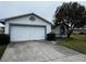 Front view of a single story house with a garage at 2290 Silver Re Dr, Lakeland, FL 33810