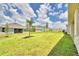 Landscaped backyard with grassy area at 237 Piave St, Haines City, FL 33844