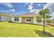 Private backyard with covered patio and tree at 237 Piave St, Haines City, FL 33844