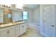 Double vanity bathroom with a soaking tub and shower at 237 Piave St, Haines City, FL 33844