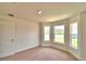 Bright bedroom with bay window, neutral walls, and carpeting at 237 Piave St, Haines City, FL 33844