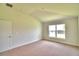 Bright bedroom featuring a large window and carpet flooring at 237 Piave St, Haines City, FL 33844