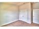 Spacious bedroom with double doors and wall-to-wall carpet at 237 Piave St, Haines City, FL 33844