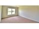 Simple bedroom with carpeted floor and large window at 237 Piave St, Haines City, FL 33844